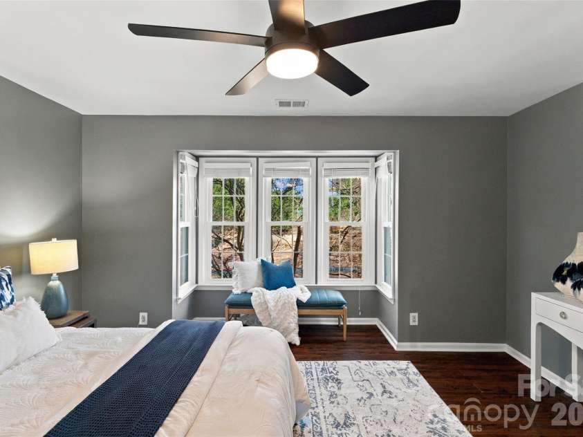 762 Marsh Road, Charlotte, NC 28209.  MLS# CAR4340120, YatesRealty ID 54407. Spacious primary bedroom with ceiling fan and abundant natural light
