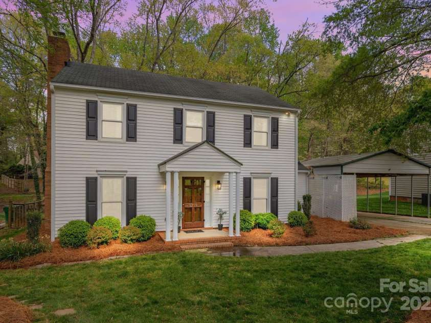 9319 Harps Mill Court, Charlotte, NC 28270.  MLS# CAR4244091, YatesRealty ID 5441. Charming home at dusk