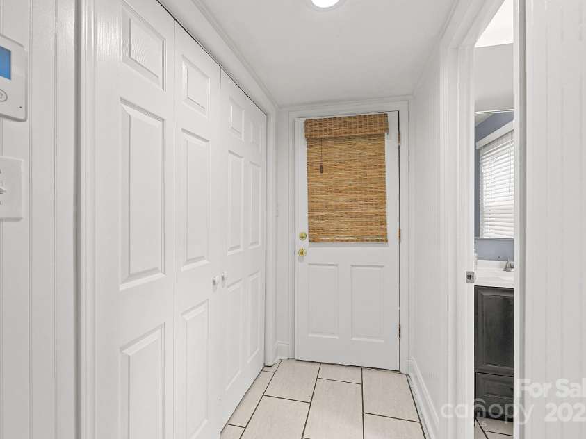 9319 Harps Mill Court, Charlotte, NC 28270.  MLS# CAR4244091, YatesRealty ID 5441. Entry from Carport