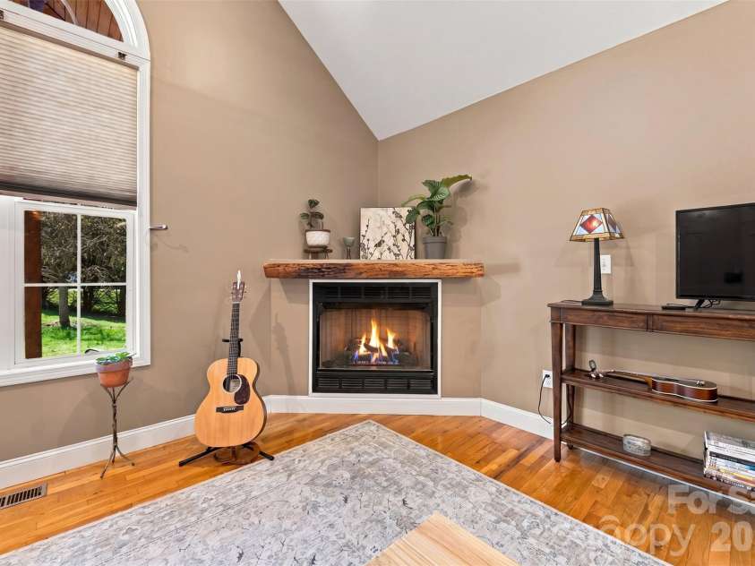 8 Maltese Lane, Weaverville, NC 28787.  MLS# CAR4430513, YatesRealty ID 54416. Fireplace with gas logs.