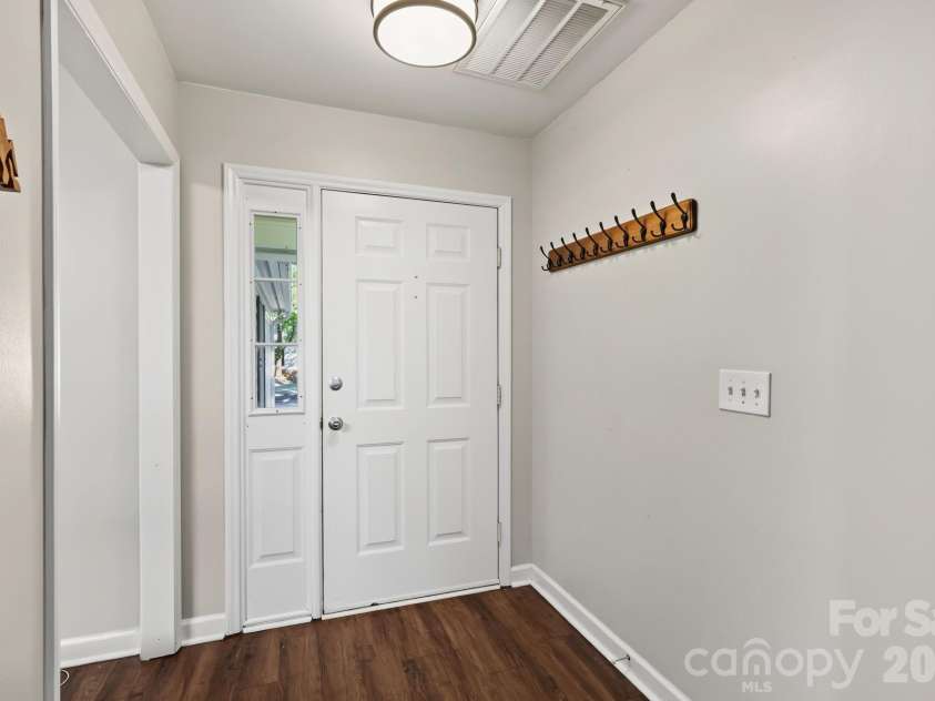 13820 Portpatrick Lane, Matthews, NC 28105.  MLS# CAR4427507, YatesRealty ID 54428. Front door looking outside
