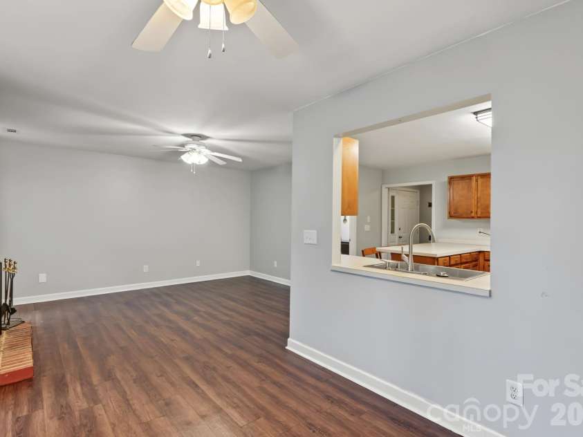 13820 Portpatrick Lane, Matthews, NC 28105.  MLS# CAR4427507, YatesRealty ID 54428. Kitchen and living area