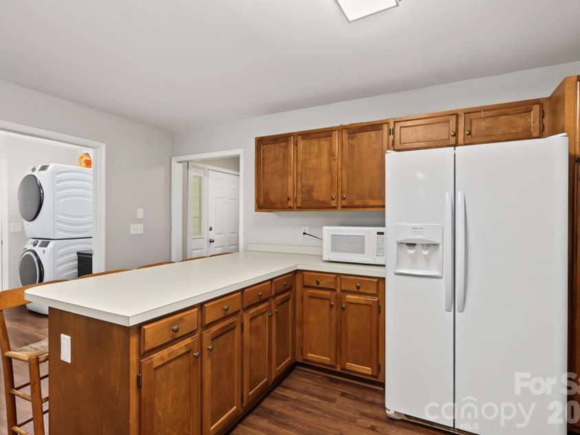 13820 Portpatrick Lane, Matthews, NC 28105.  MLS# CAR4427507, YatesRealty ID 54428. Kitchen with view of laundry room