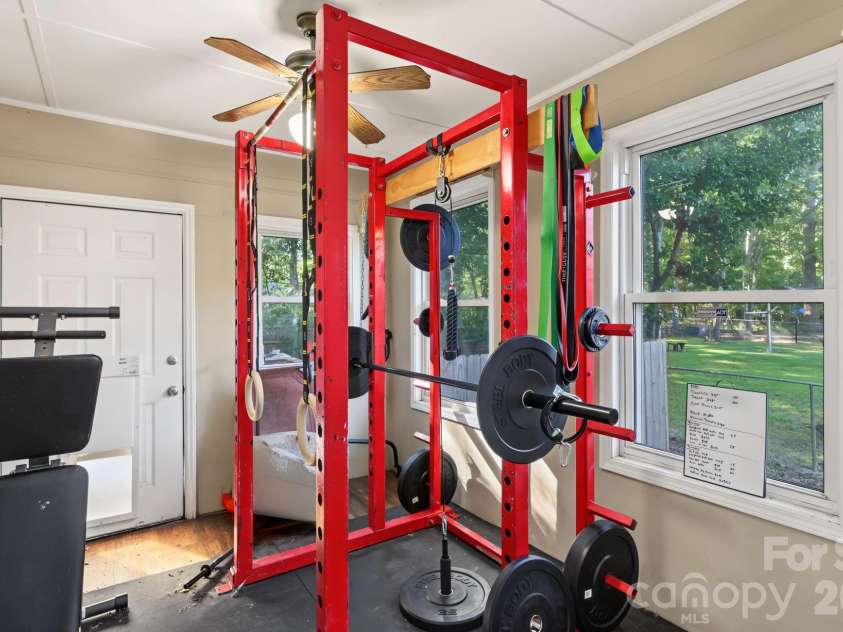 13820 Portpatrick Lane, Matthews, NC 28105.  MLS# CAR4427507, YatesRealty ID 54428. The sunroom/workout room