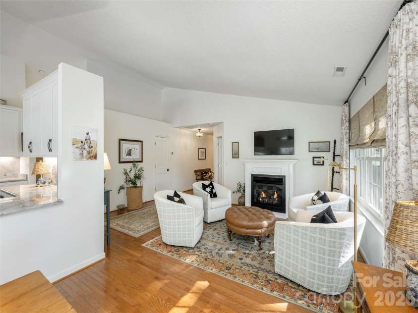 277 Highland Golf Drive, Flat Rock, NC 28731.  MLS# CAR4430345, YatesRealty ID 54429. Cozy setting with fireplace.