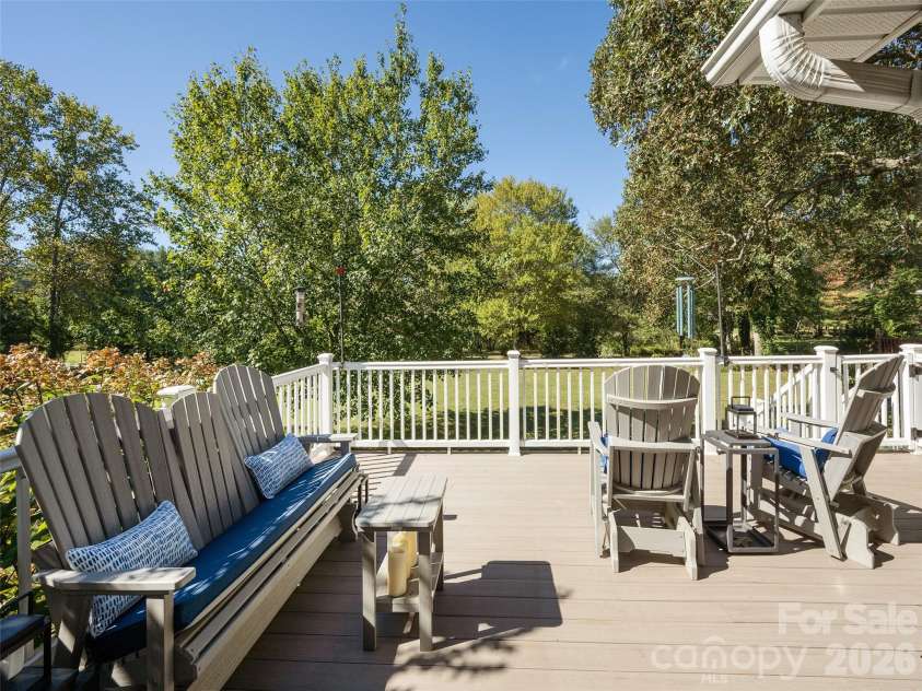 277 Highland Golf Drive, Flat Rock, NC 28731.  MLS# CAR4430345, YatesRealty ID 54429. Deck overlooks expansive yard and Flat Rock Park.