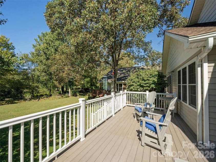 277 Highland Golf Drive, Flat Rock, NC 28731.  MLS# CAR4430345, YatesRealty ID 54429. Deck with awning closed to accommodate more sun.