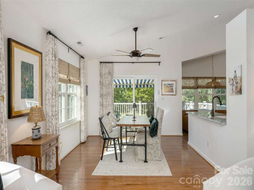 277 Highland Golf Drive, Flat Rock, NC 28731.  MLS# CAR4430345, YatesRealty ID 54429. Dining area with sliding doors to deck and open counter to kitchen.