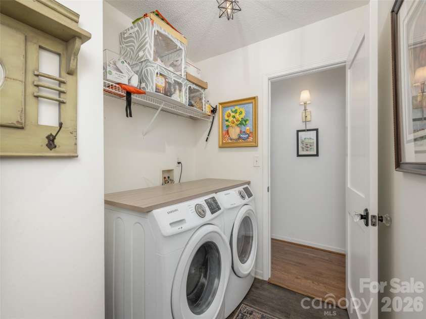 277 Highland Golf Drive, Flat Rock, NC 28731.  MLS# CAR4430345, YatesRealty ID 54429. Laundry room connects to garage and interior hall adjacent to kitchen.