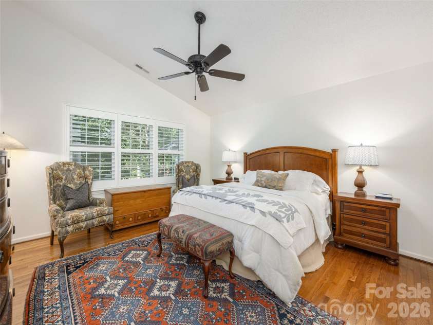 277 Highland Golf Drive, Flat Rock, NC 28731.  MLS# CAR4430345, YatesRealty ID 54429. Spacious primary suite with large windows facing the park.