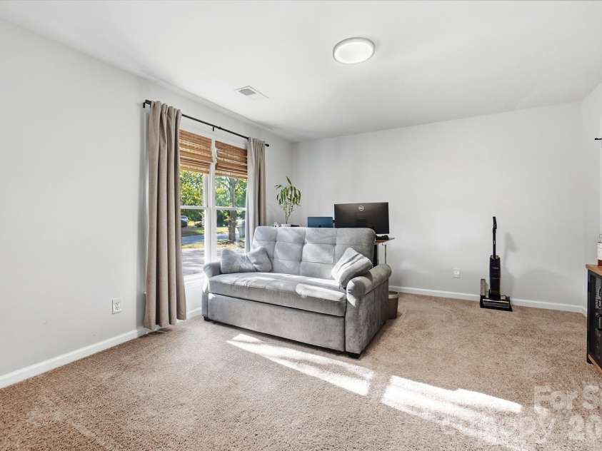 127 Sea Island Boulevard, Fort Mill, SC 29708.  MLS# CAR4429443, YatesRealty ID 54430. Spacious primary bedroom or a home office