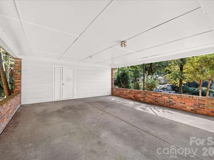2936 Burnt Mill Road, Charlotte, NC 28210.  MLS# CAR4429775, YatesRealty ID 54453. Carport with Storage