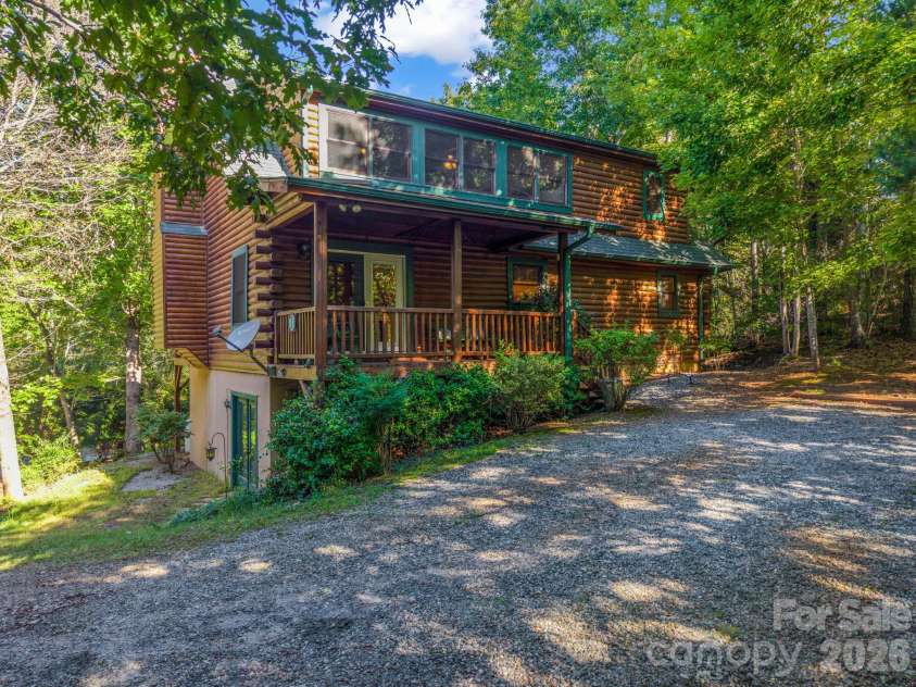 124 Starling Lane, Lake Lure, NC 28746.  MLS# CAR4430565, YatesRealty ID 54465. Back and driveway side