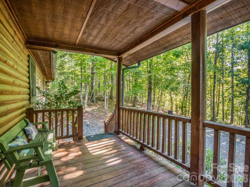 124 Starling Lane, Lake Lure, NC 28746.  MLS# CAR4430565, YatesRealty ID 54465. Back covered porch