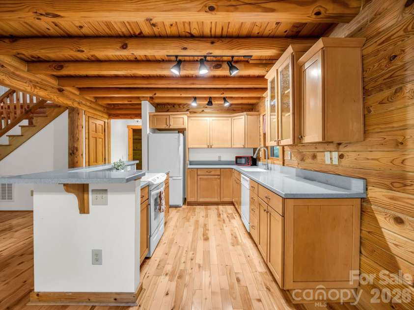 124 Starling Lane, Lake Lure, NC 28746.  MLS# CAR4430565, YatesRealty ID 54465. Kitchen w/solid surface countertops
