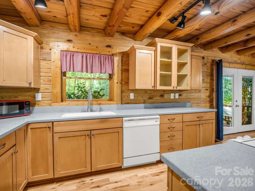 124 Starling Lane, Lake Lure, NC 28746.  MLS# CAR4430565, YatesRealty ID 54465. Kitchen w/stove in island