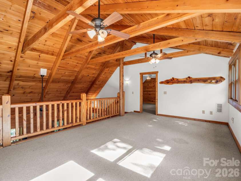 124 Starling Lane, Lake Lure, NC 28746.  MLS# CAR4430565, YatesRealty ID 54465. Loft towards upper level ensuite