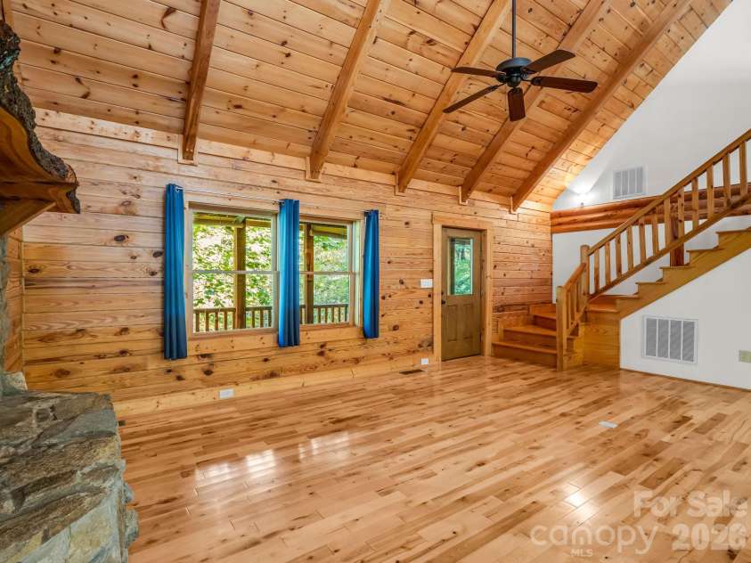 124 Starling Lane, Lake Lure, NC 28746.  MLS# CAR4430565, YatesRealty ID 54465. LR towards front door