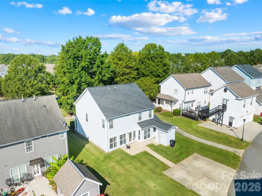 19822 Davidson Concord Road, Davidson, NC 28036.  MLS# CAR4429435, YatesRealty ID 54473. Back side aerial view of home