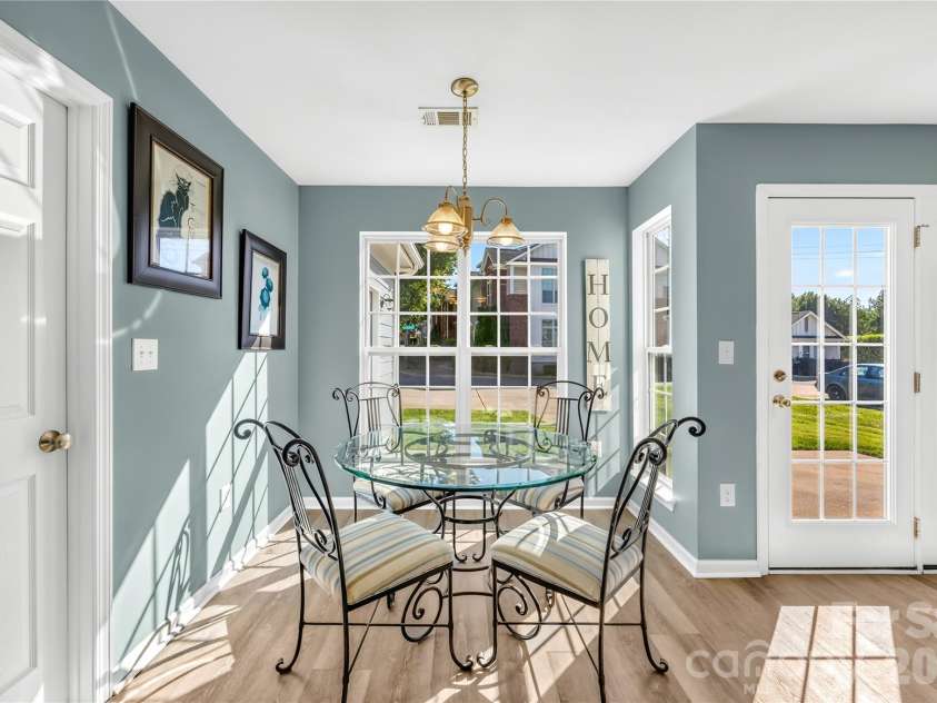 19822 Davidson Concord Road, Davidson, NC 28036.  MLS# CAR4429435, YatesRealty ID 54473. Breakfast area with natural lighting, door to left Laundry Room
