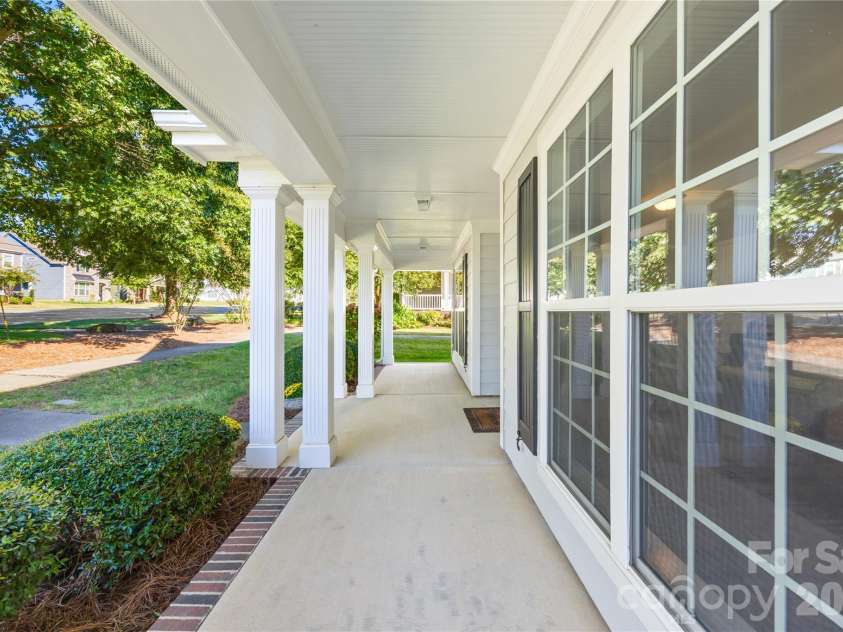 19822 Davidson Concord Road, Davidson, NC 28036.  MLS# CAR4429435, YatesRealty ID 54473. Covered front porch