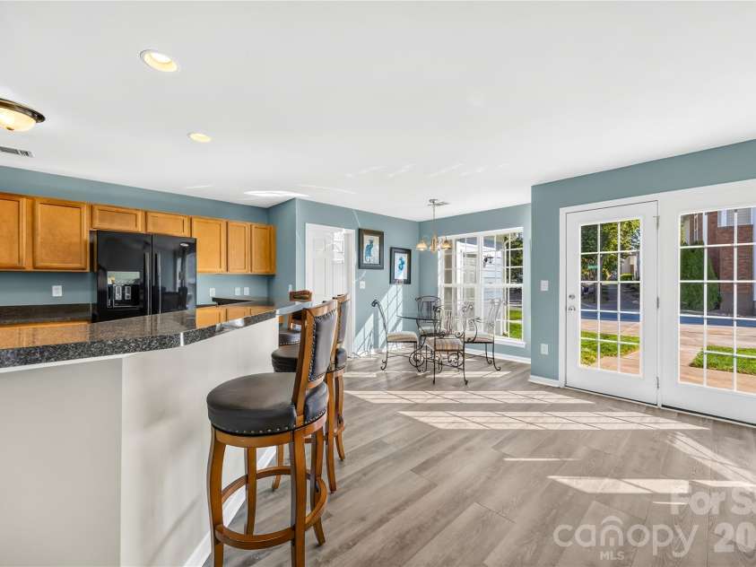 19822 Davidson Concord Road, Davidson, NC 28036.  MLS# CAR4429435, YatesRealty ID 54473. Kitchen, Breakfast Area, and back entrance into home.