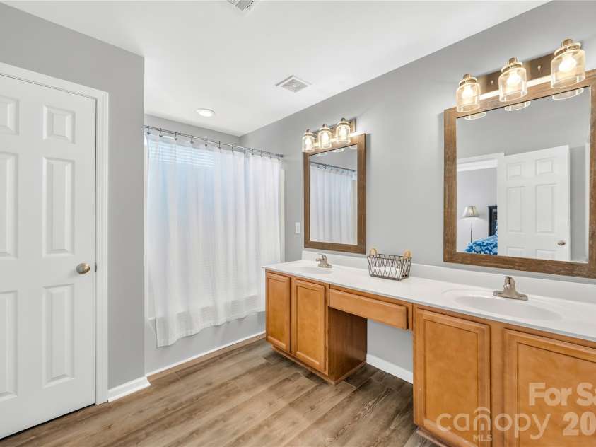 19822 Davidson Concord Road, Davidson, NC 28036.  MLS# CAR4429435, YatesRealty ID 54473. Primary Bathroom with dual sinks,makeup vanity, linen closet, and clothes and water closet(not shown in picture) Please see floorplan