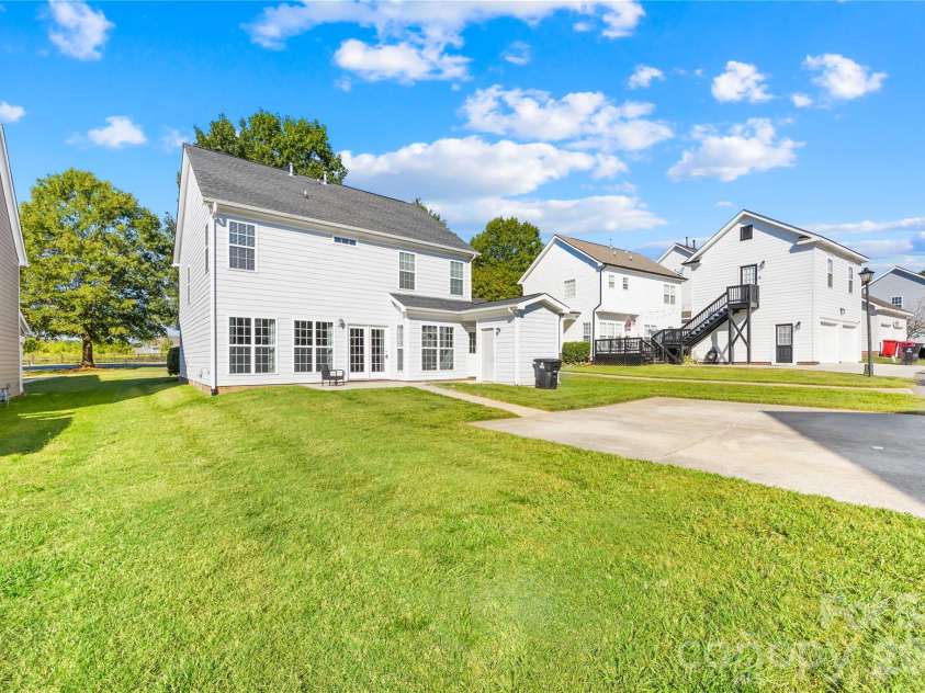 19822 Davidson Concord Road, Davidson, NC 28036.  MLS# CAR4429435, YatesRealty ID 54473. Rear side view of home
