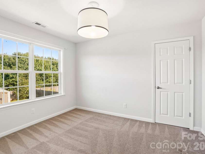 244 Mud Creek Road, Fletcher, NC 28732.  MLS# CAR4429166, YatesRealty ID 54476. Bedroom Facing Back