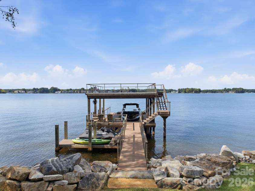 112 Birdsong Lane, Mooresville, NC 28117.  MLS# CAR4430430, YatesRealty ID 54482. Double tiered fixed dock with boat lift.
