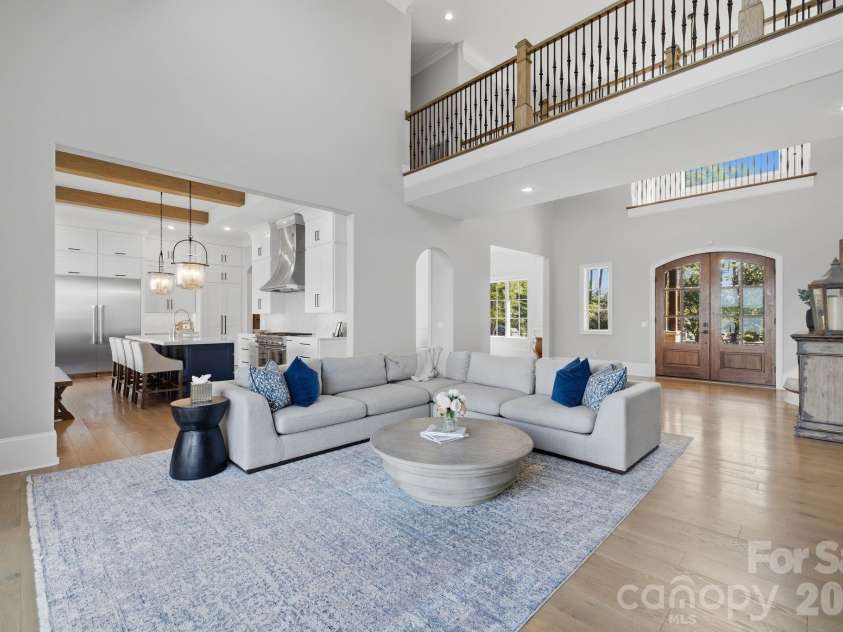 112 Birdsong Lane, Mooresville, NC 28117.  MLS# CAR4430430, YatesRealty ID 54482. Open great room showcasing the home’s impressive scale and architecture.