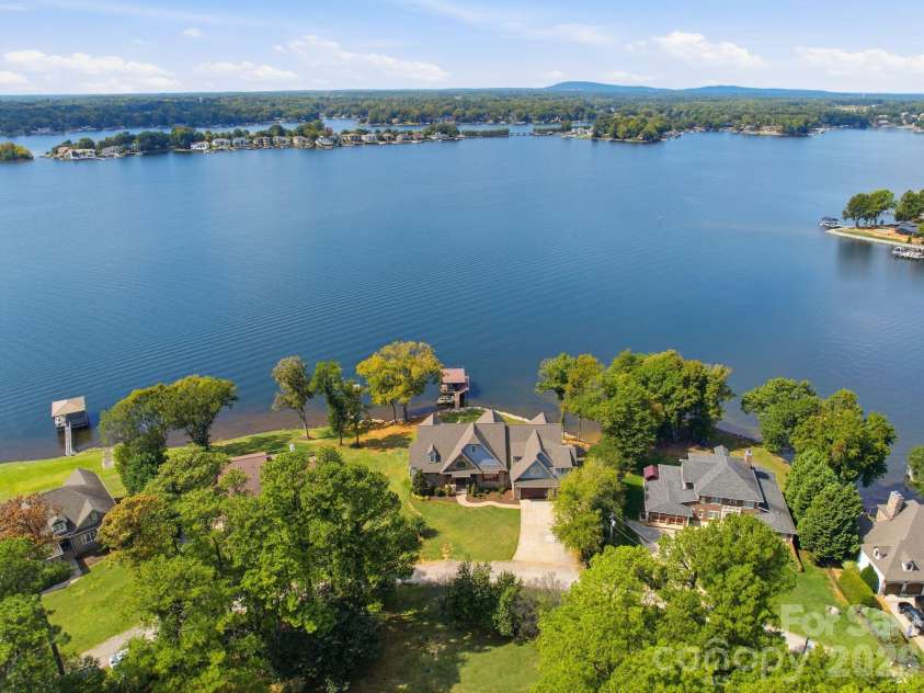 112 Birdsong Lane, Mooresville, NC 28117.  MLS# CAR4430430, YatesRealty ID 54482. Overhead view showing both properties totaling approx 1.44 Acres