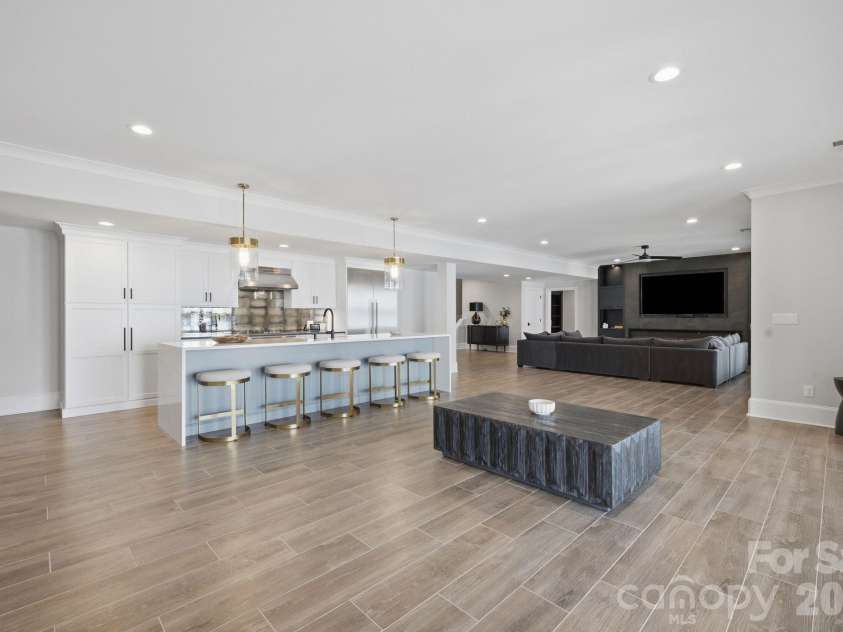 112 Birdsong Lane, Mooresville, NC 28117.  MLS# CAR4430430, YatesRealty ID 54482. Pool level lounge area.