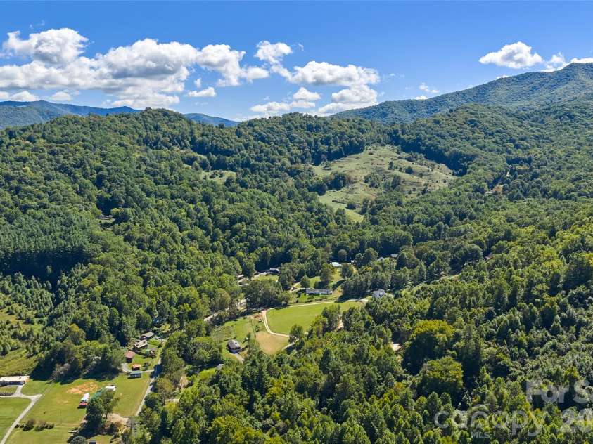 60 Spring Mountain Drive, Canton, NC 28716.  MLS# CAR4419213, YatesRealty ID 54498. Ridgelines stack up above Burnette Cove