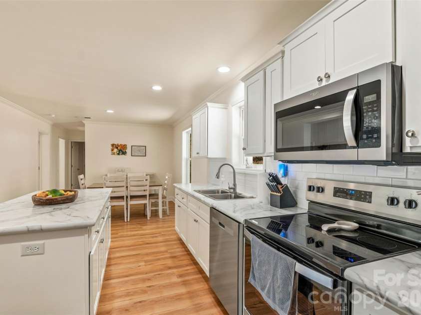 60 Spring Mountain Drive, Canton, NC 28716.  MLS# CAR4419213, YatesRealty ID 54498. Stainless appliances, island and breakfast bar