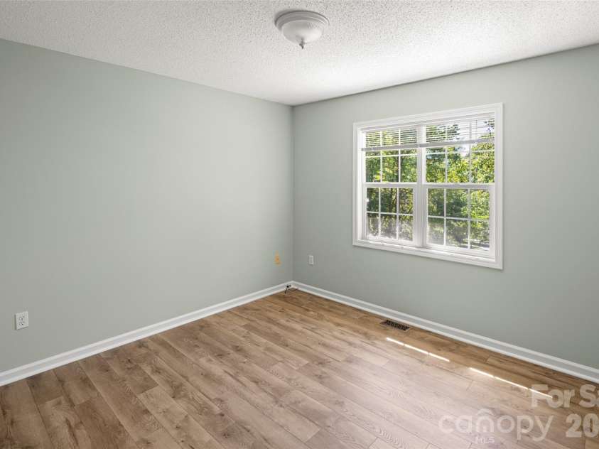 39 Mountain Site Lane, Asheville, NC 28803.  MLS# CAR4430825, YatesRealty ID 54505. 2nd bedroom looking out over views