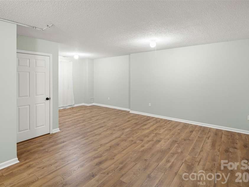 39 Mountain Site Lane, Asheville, NC 28803.  MLS# CAR4430825, YatesRealty ID 54505. Finished basement