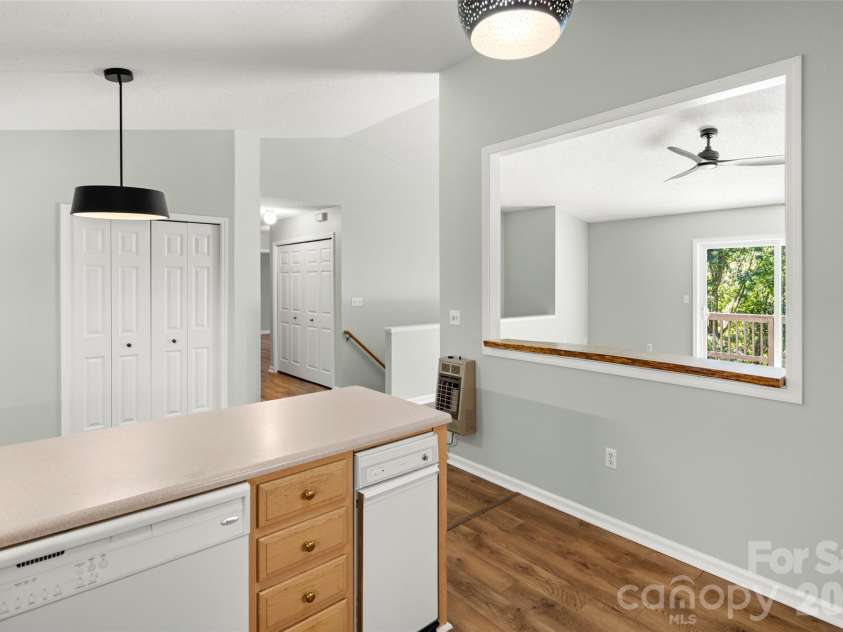 39 Mountain Site Lane, Asheville, NC 28803.  MLS# CAR4430825, YatesRealty ID 54505. Large pantry storage space and trash compactor