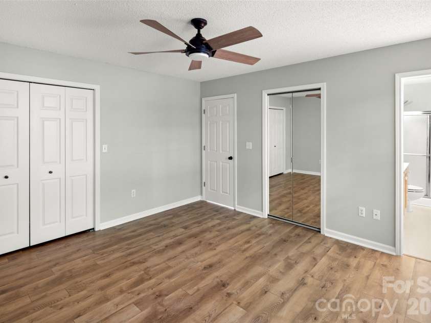 39 Mountain Site Lane, Asheville, NC 28803.  MLS# CAR4430825, YatesRealty ID 54505. Primary bedroom with a custom closet
