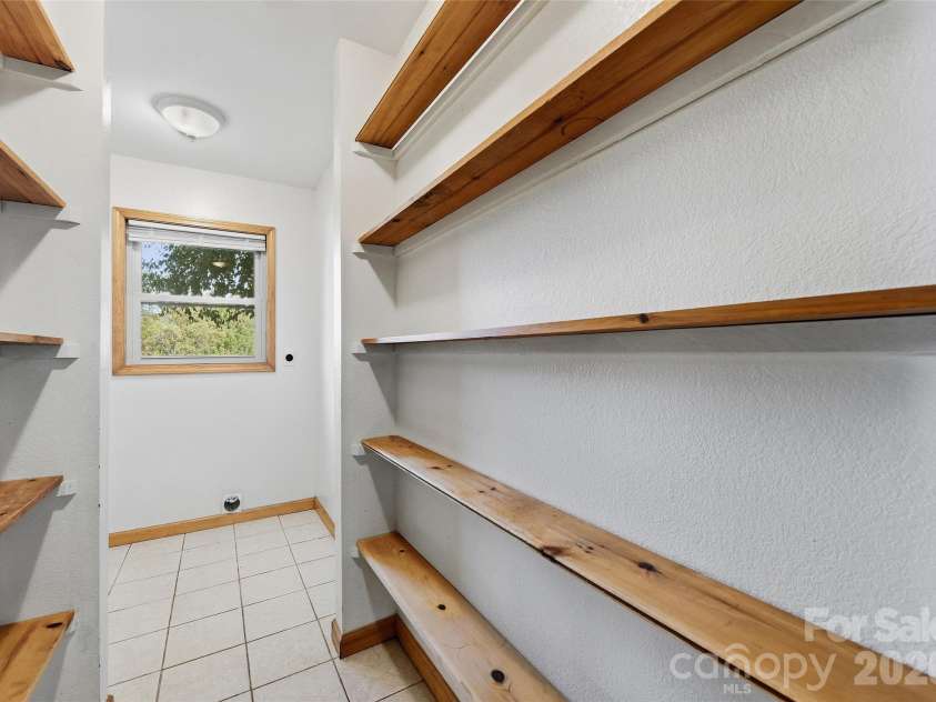 144 Appalachian Trail, Maggie Valley, NC 28751.  MLS# CAR4429734, YatesRealty ID 54509. Pantry and Laundry Room