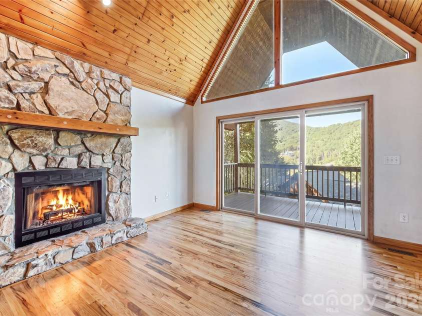 144 Appalachian Trail, Maggie Valley, NC 28751.  MLS# CAR4429734, YatesRealty ID 54509. Wood-Burning Stone Fireplace