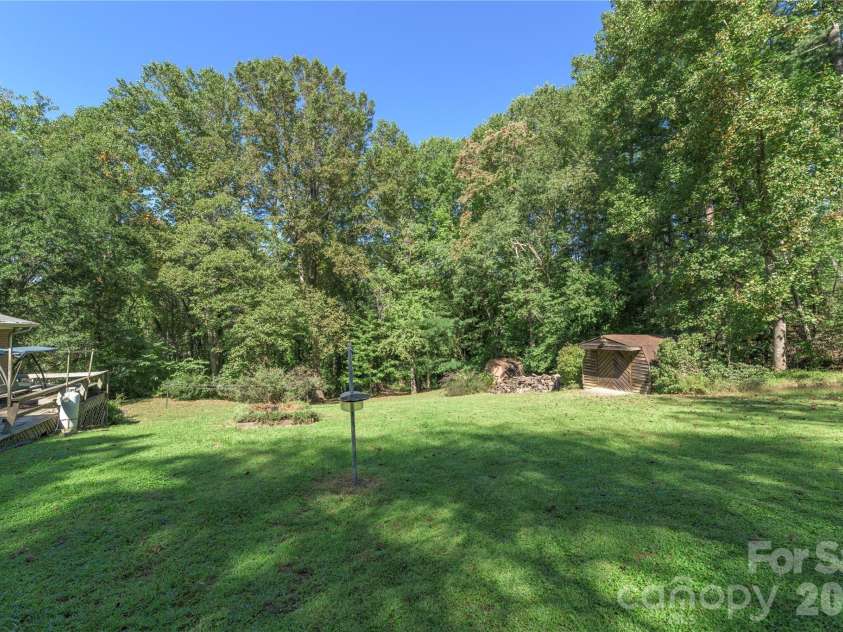 2882 Butler Bridge Road, Mills River, NC 28759.  MLS# CAR4430985, YatesRealty ID 54527. Spacious Level Back Yard