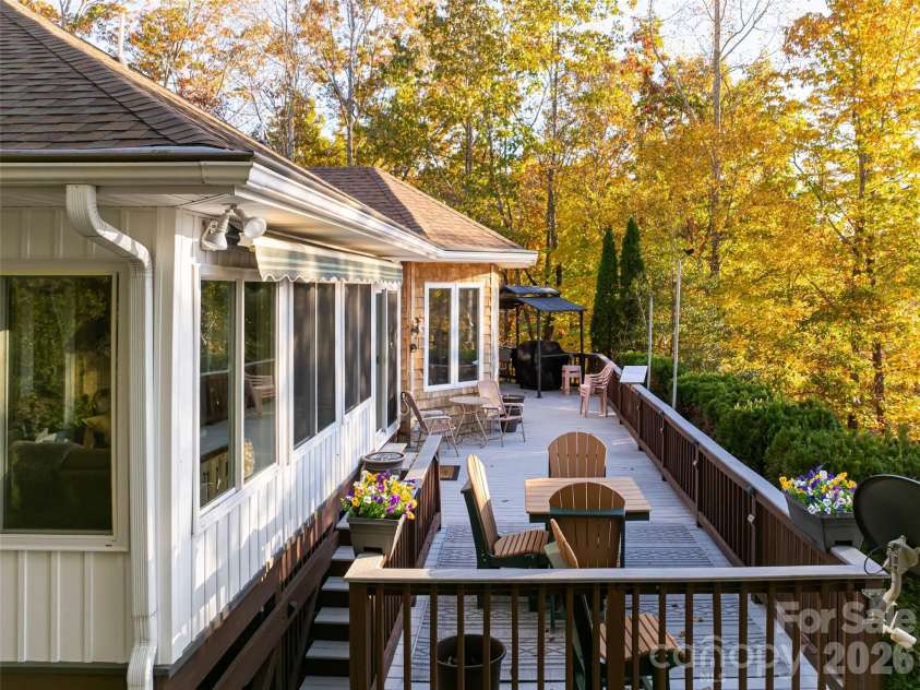 1341 Forest Lake Heights Drive, Nebo, NC 28761.  MLS# CAR4339850, YatesRealty ID 5453. Large deck off back overlooking water and mountains