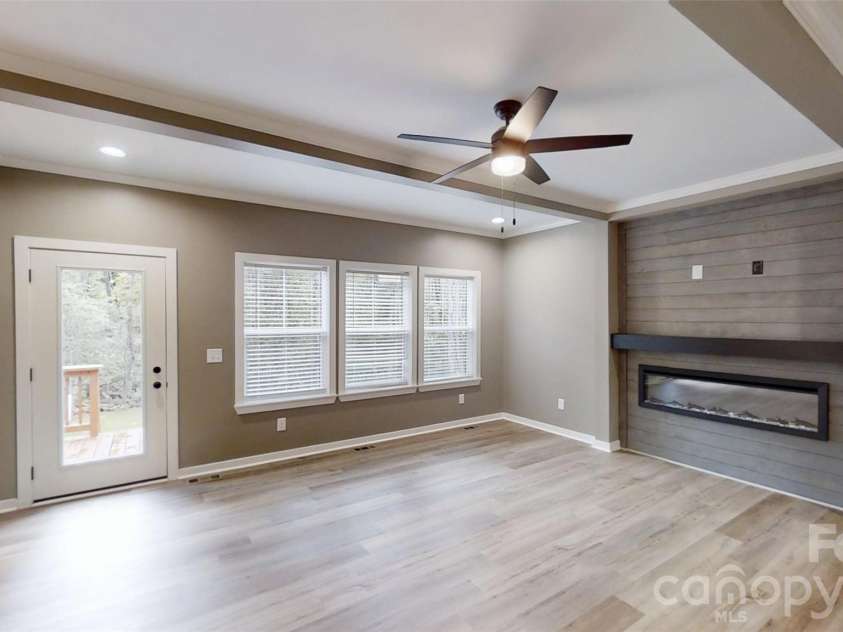 101 Riverhills Lane, Morganton, NC 28655.  MLS# CAR4401329, YatesRealty ID 54549. Living room with electric fireplace