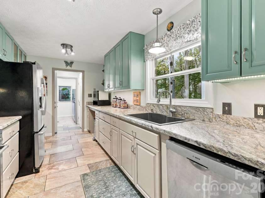 14 Cambridge Drive, Candler, NC 28715.  MLS# CAR4431024, YatesRealty ID 54554. Bright Galley Kitchen