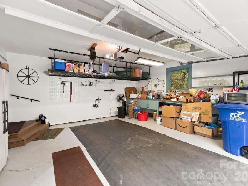 14 Cambridge Drive, Candler, NC 28715.  MLS# CAR4431024, YatesRealty ID 54554. Great Main Level garage with great storage