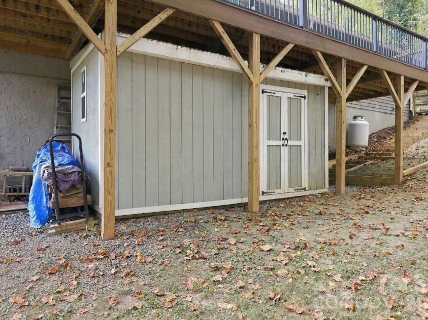 14 Cambridge Drive, Candler, NC 28715.  MLS# CAR4431024, YatesRealty ID 54554. MORE Storage under deck