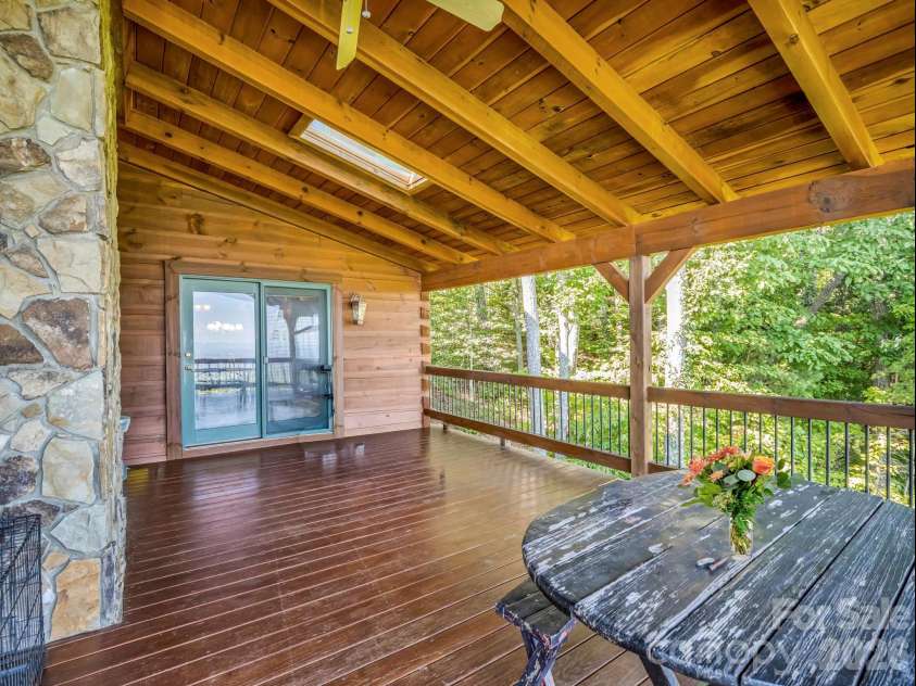 5409 Mineral Springs Mountain Avenue, Valdese, NC 28690.  MLS# CAR4426784, YatesRealty ID 54559. Main level covered deck off dining room