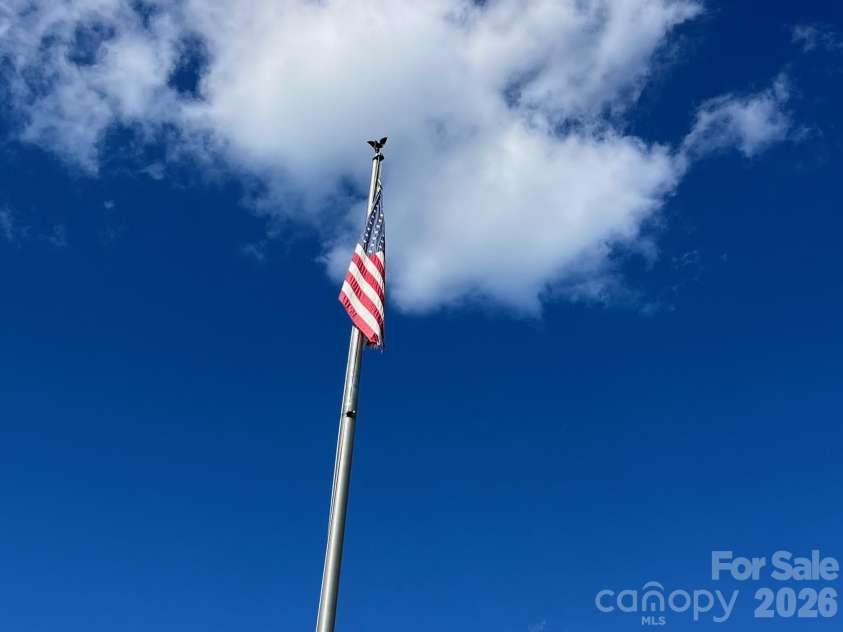 4146 Startown Road, Newton, NC 28658.  MLS# CAR4429519, YatesRealty ID 54576. Flag in the front yard