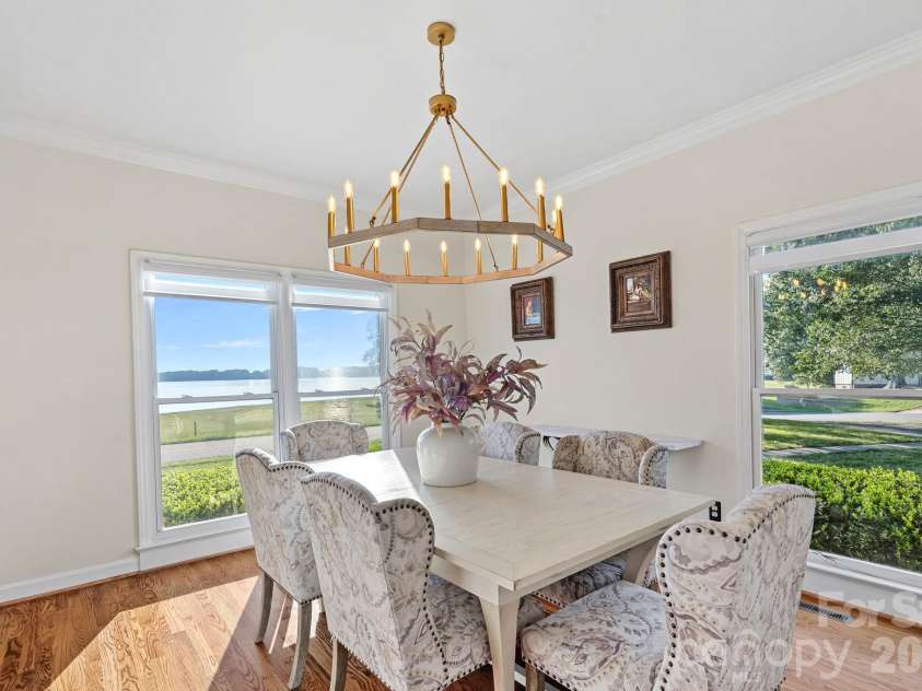 8049 Ravenwood Lane, Stanley, NC 28164.  MLS# CAR4426461, YatesRealty ID 54579. Dining room with lake view